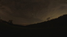 stars and clouds in the night sky time-lapse 
