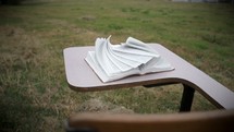 pages of a Bible on a student desk turning in the breeze 