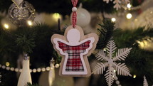Wooden angel Christmas ornament on the tree