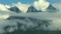 clouds moving over three sisters mountain peaks