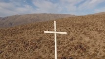 Aerial video of a cross on a mountainside.  Multiple clips from different angles and flying camera movements.   Filmed with a DJI Phantom 3 Professional quadcopter drone.  