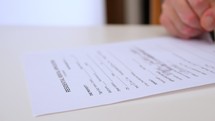 Man filling out form for housing rental
