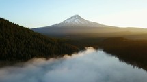 rising fog over a mountain lake 