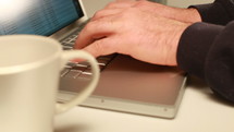 Man's Hand Typing On Laptop