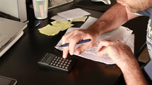 calculation and frustration paying bills 