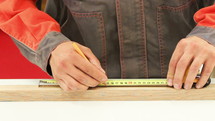 Measuring a piece of wood.