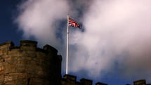 British flag flying over a castle 
