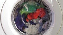 clothes spinning in a washing machine 