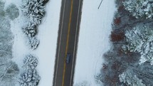a car driving on a road in winter 