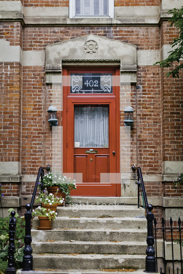 red front door on a townhouse 