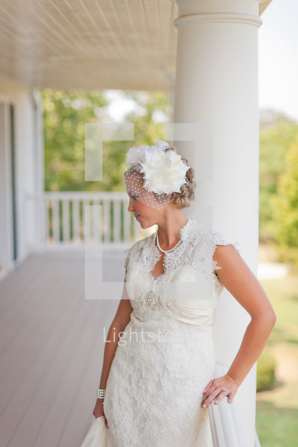 Bride standing on a large porch