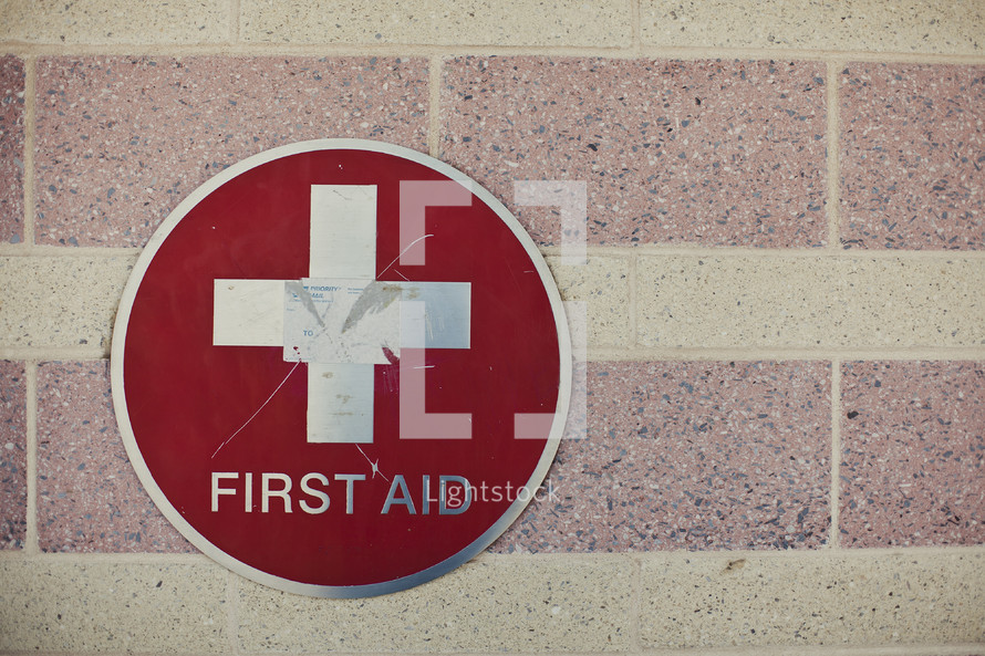 First aid sign on building