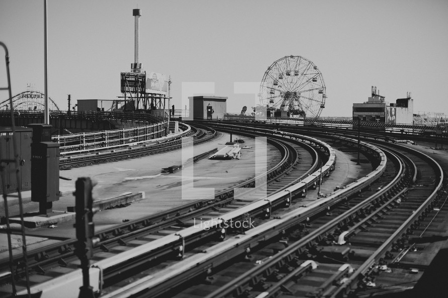 Train tracks by amusement park