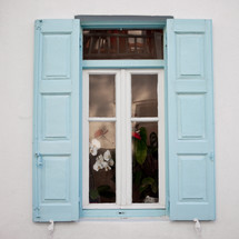 window with light blue shutters