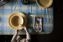 a child sitting at a dinner table 