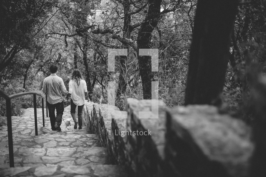 Couple walking down a stone staircase