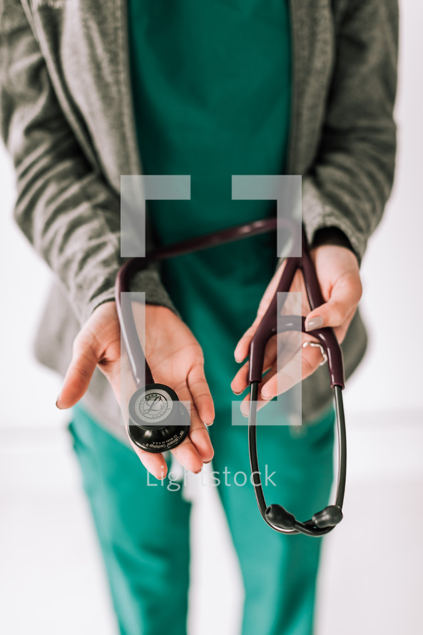 a nurse holding a stethoscope 