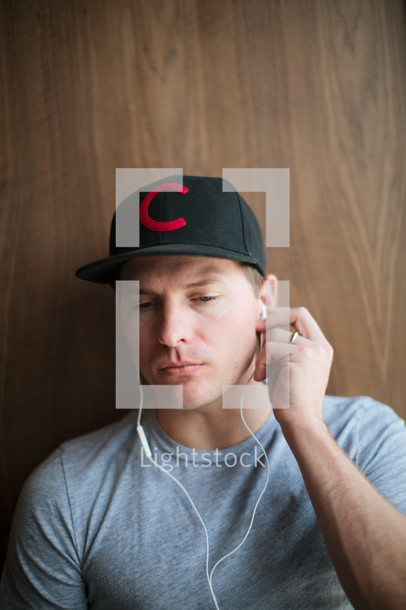 a man listening to earbuds 