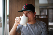 a man drinking coffee 