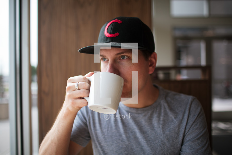a man drinking coffee 