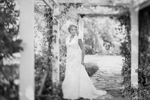 Bride standing in a garden