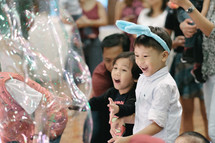 children playing with giant bubbles 