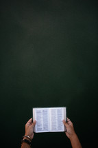 woman reading a pocket Bible 