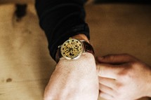 A man's arm wearing a wrist watch.
