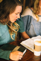 college students gathered in a coffee shop for a Bible study 