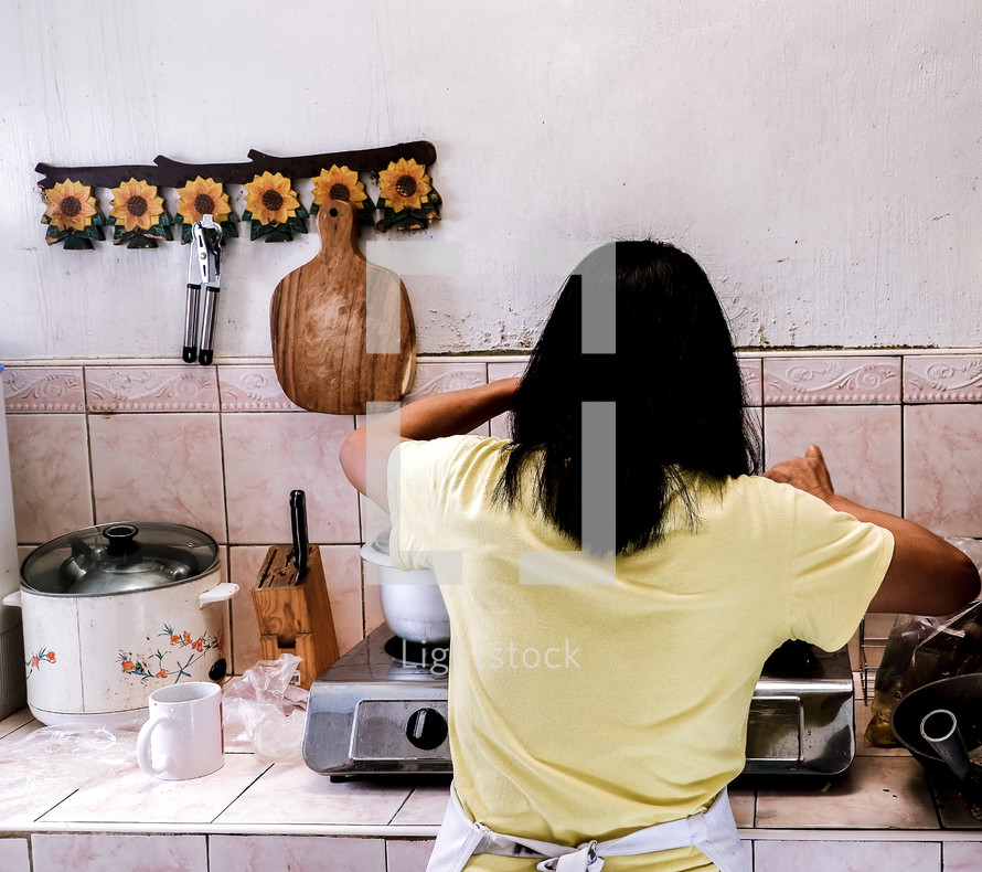 a woman kicking in a kitchen 