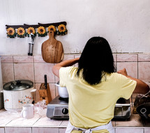 a woman kicking in a kitchen 