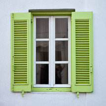 window with lime green shutters