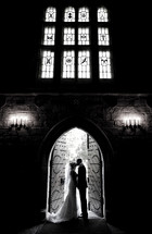 bride and groom kissing in the doorway 