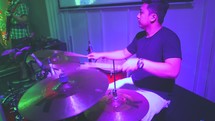a drummer on stage during a worship service 
