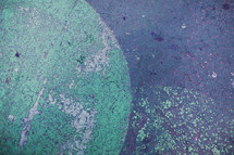 blue green painted on to asphalt - texture - circles 