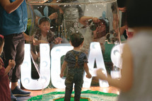 children playing with bubbles at an Easter festival 