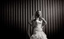 bride standing with her hands on her hips