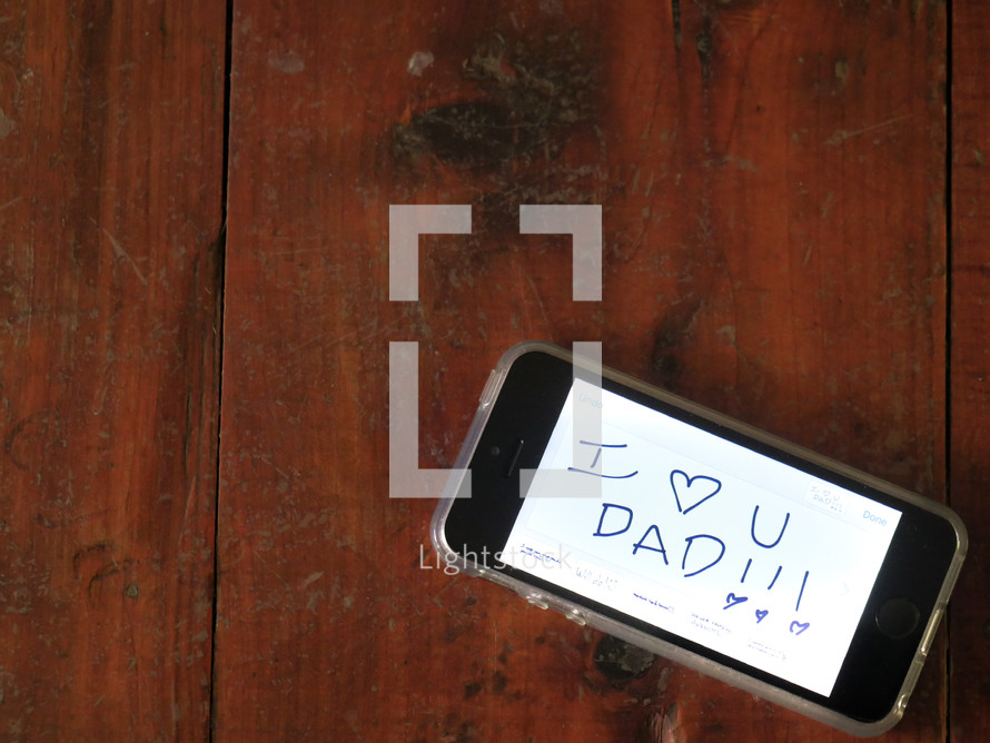 I love you dad on a cellphone screen 