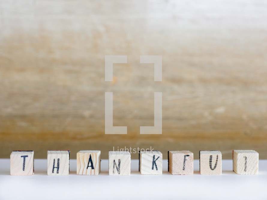 word thankful on wood blocks 