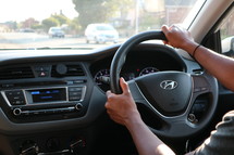 hands on a steering wheel 