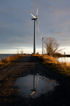 wind turbine and reflection in water 