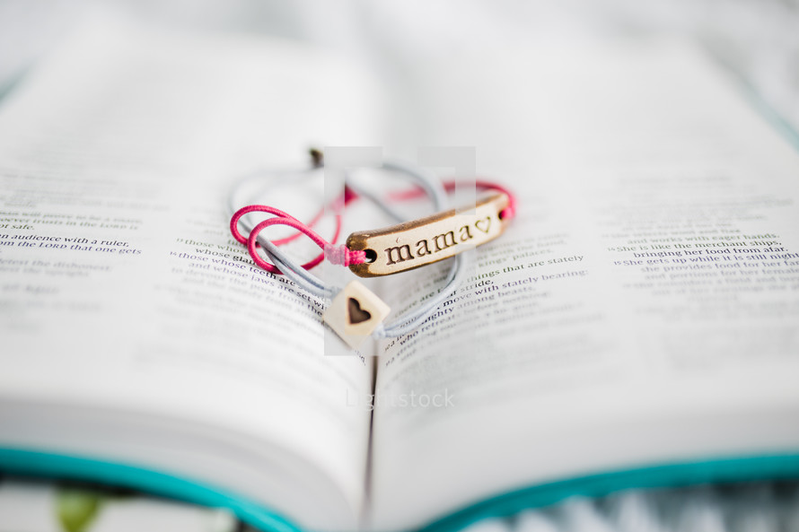 mama bracelet between the pages of a Bible 