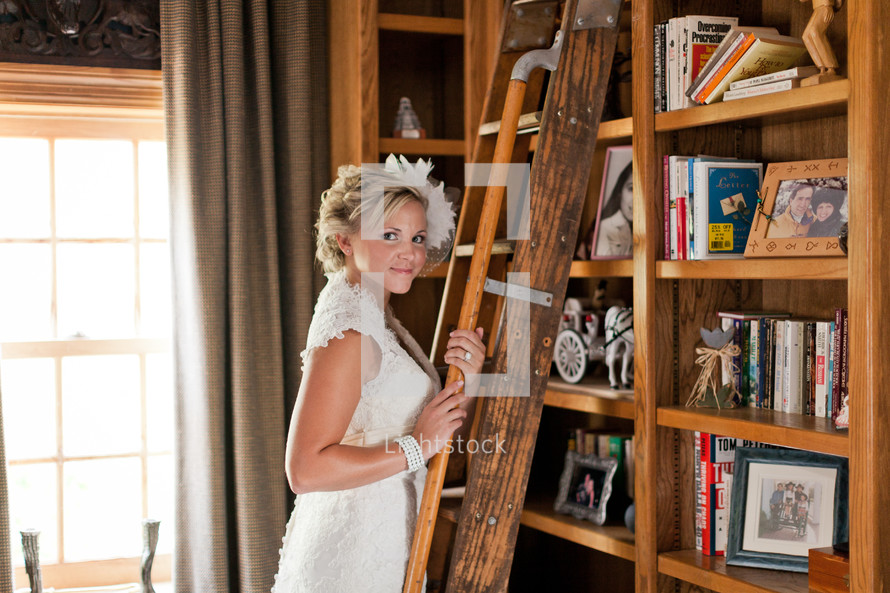 Bride standing in a library