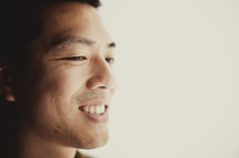 A smiling Asian man
