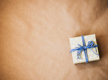 gift wrapped in brown paper and string 