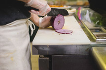 a man chopping onions 