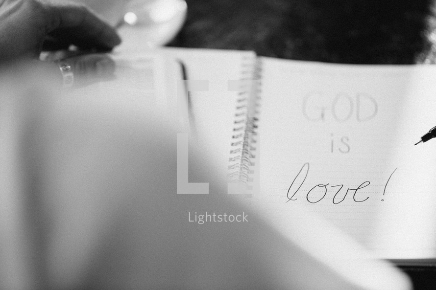 God is Love written in a journal 