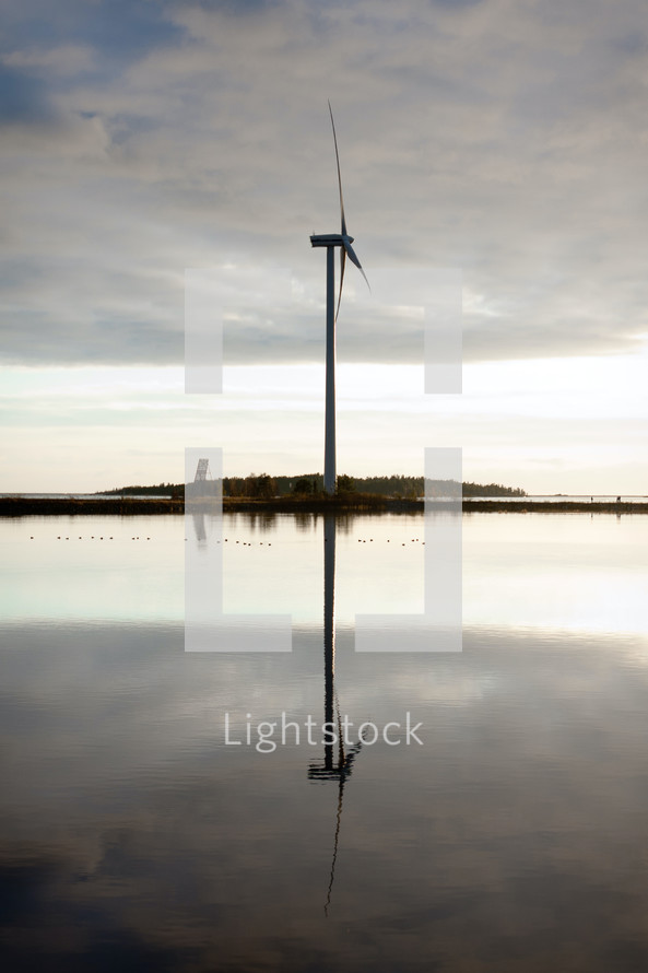wind turbine and reflection in water 