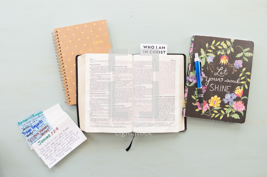 Who I am in Christ, notecards, prayer requests, open Bible, journal 