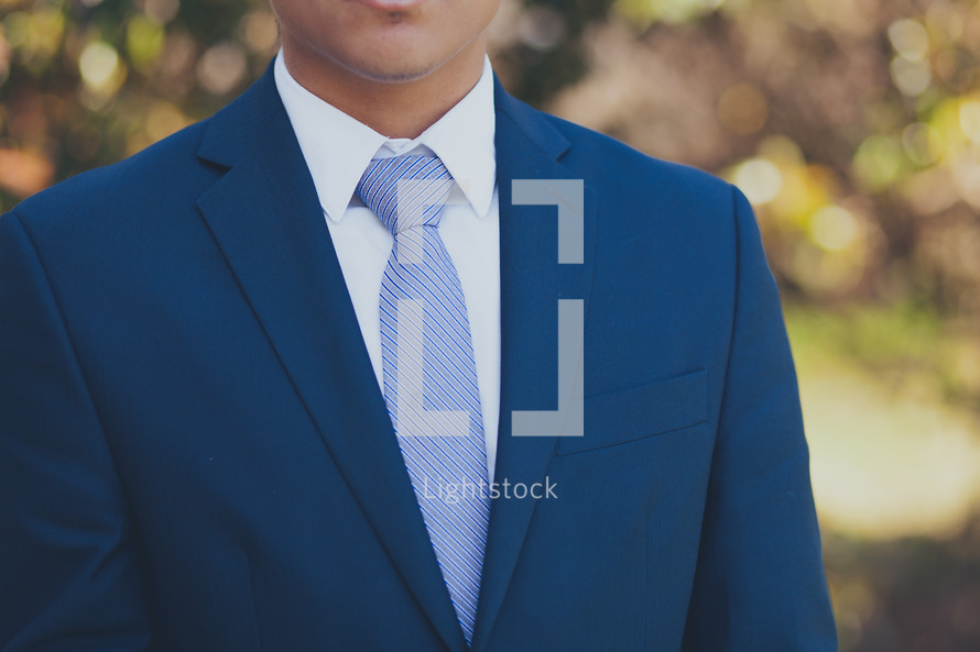 torso of a man in a business suit 